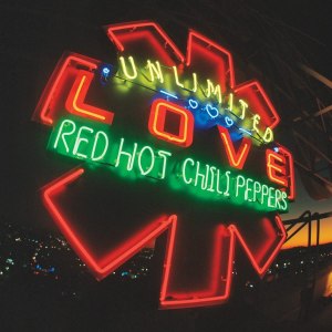 foto de uma placa-logo em neon com o nome da banda em verde e o nome do disco em amarelo (unlimited) e vermelho (love), tudo sobreposto ao símbolo da banda